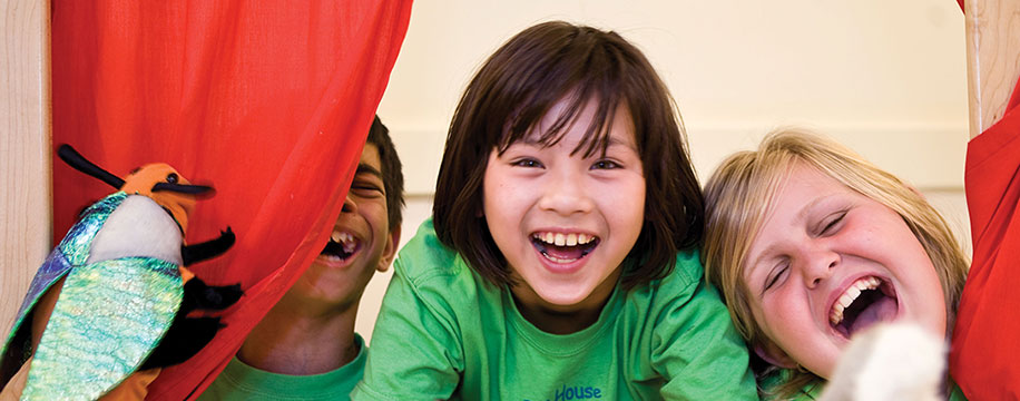 Kids playing puppet theatre
