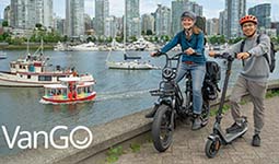 VanGo - people standing with their bikes at the seawall