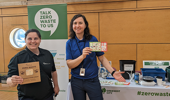 Two staff at the Zero Waste Fair booth